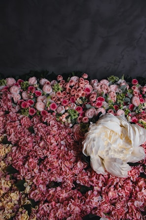 Elegant floral arrangement of blush roses with marble and gold accents