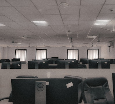 a room filled with lots of computers and chairs