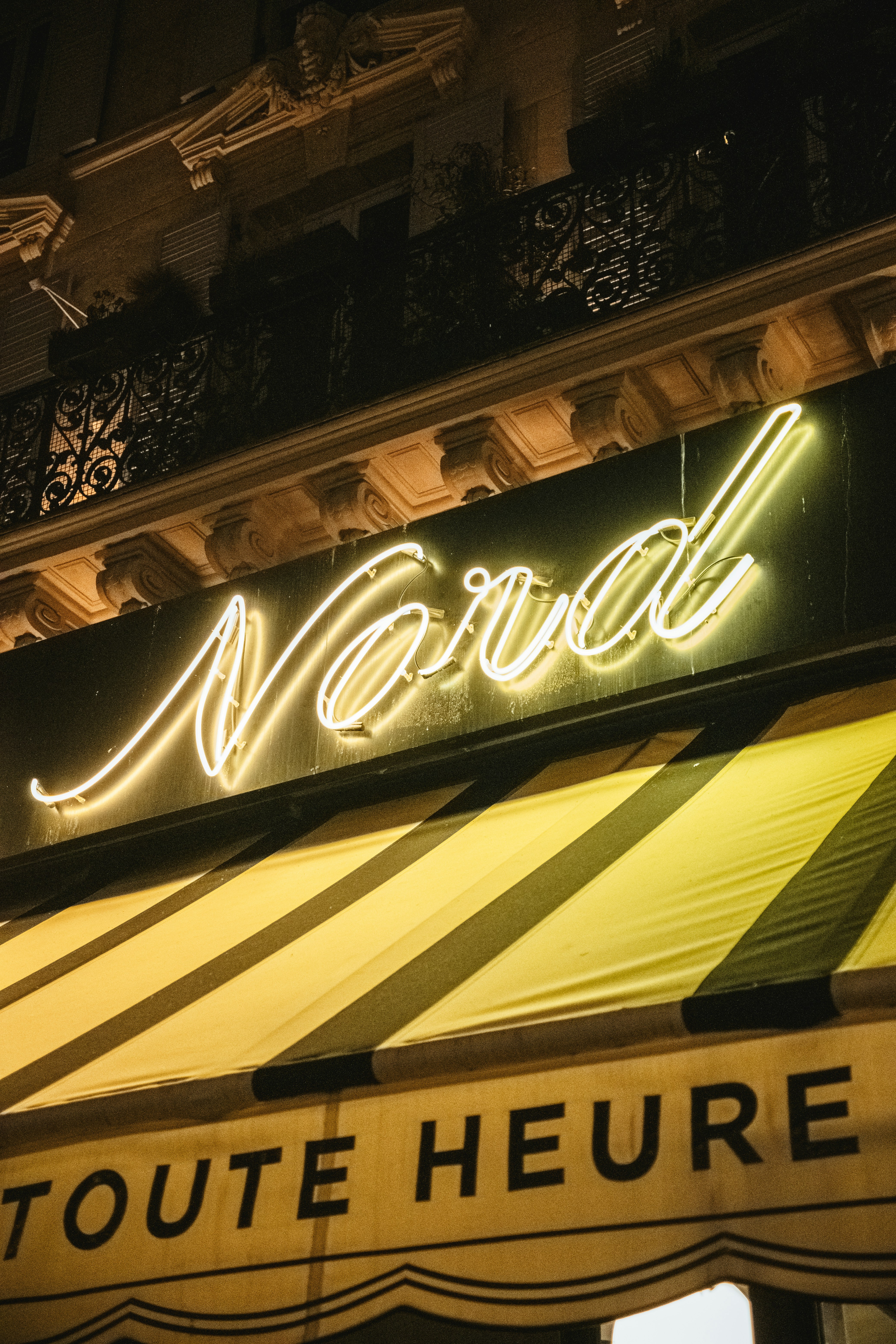 a neon sign on the side of a building