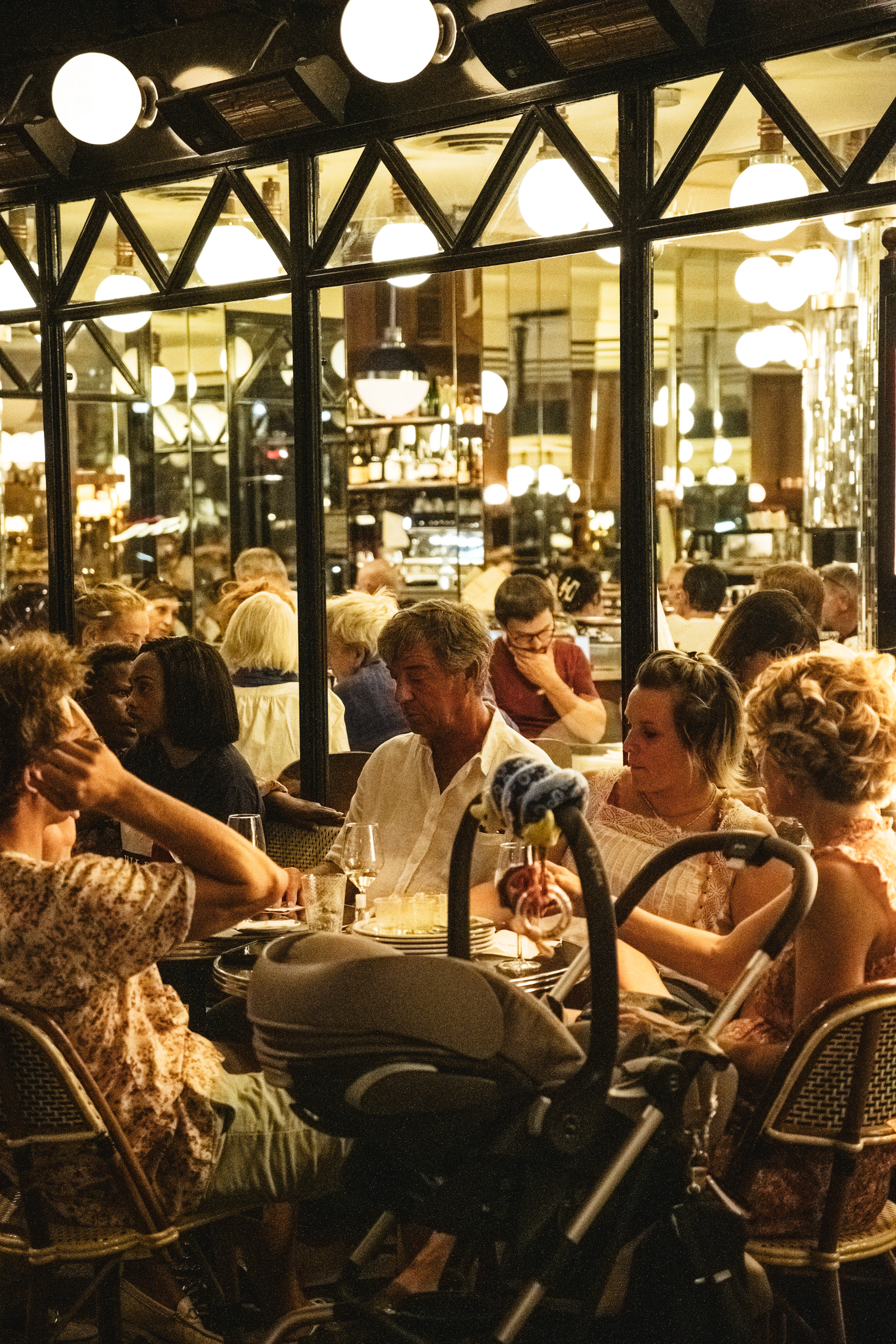 The lively interior of Vibrato Café with customers enjoying their meals and the buzz of a busy market stall atmosphere.