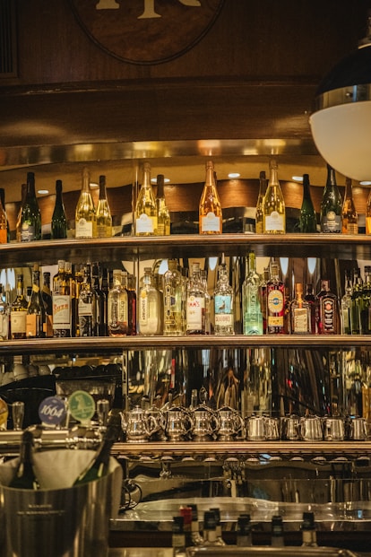 a bar filled with lots of bottles of alcohol