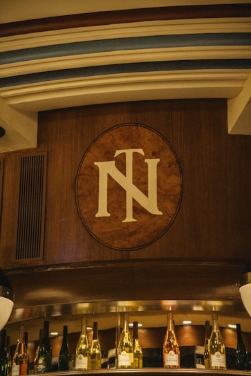 An elegant engraved wooden plaque with a personalized message, glowing softly under warm lighting.