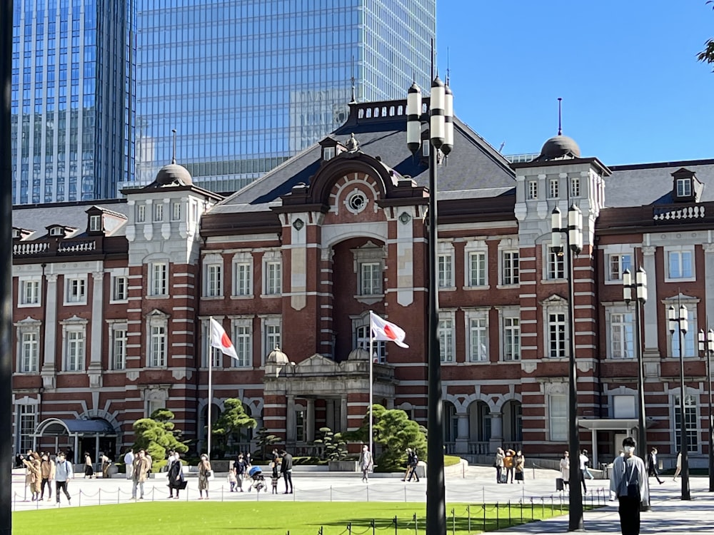 a large brick building with a flag pole in front of it