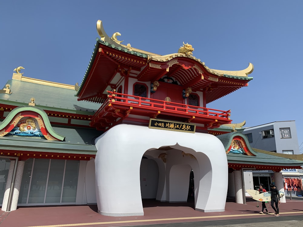 a large white building with a red roof