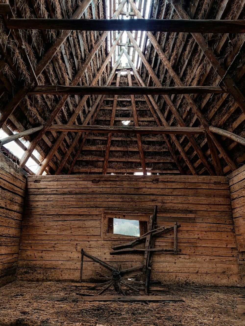 a wooden structure with a cross in the middle of it