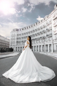 Cinematic shot of a bride walking through a sunlit Barcelona street