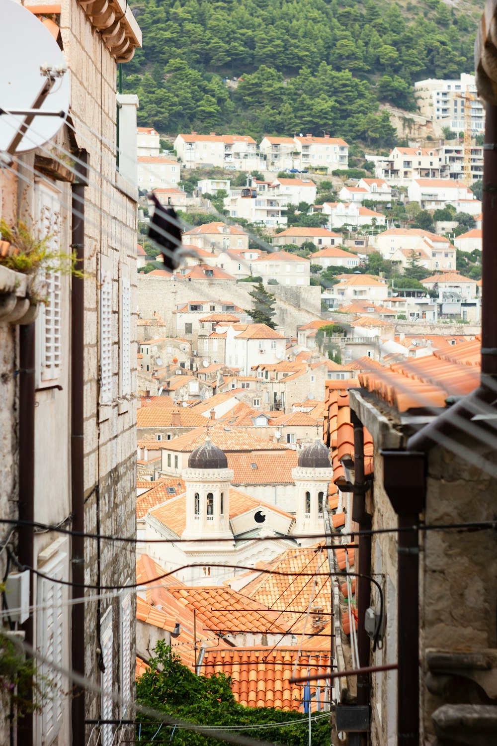 a view of a city from an alley way