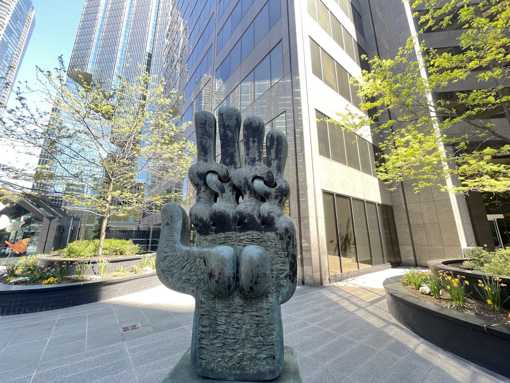 a statue of a hand holding a group of hands