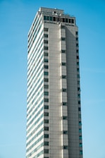 A high-rise building with spotless windows.