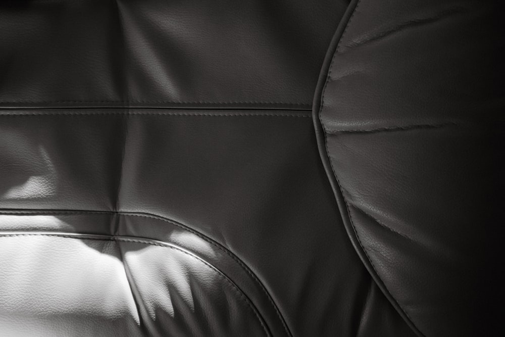 a close up of a black leather chair