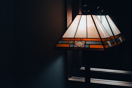 A cozy lamp featuring vibrant resin patterns illuminating a room.