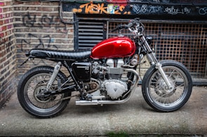 Classic motorcycle with shiny chrome details against a dark urban backdrop.