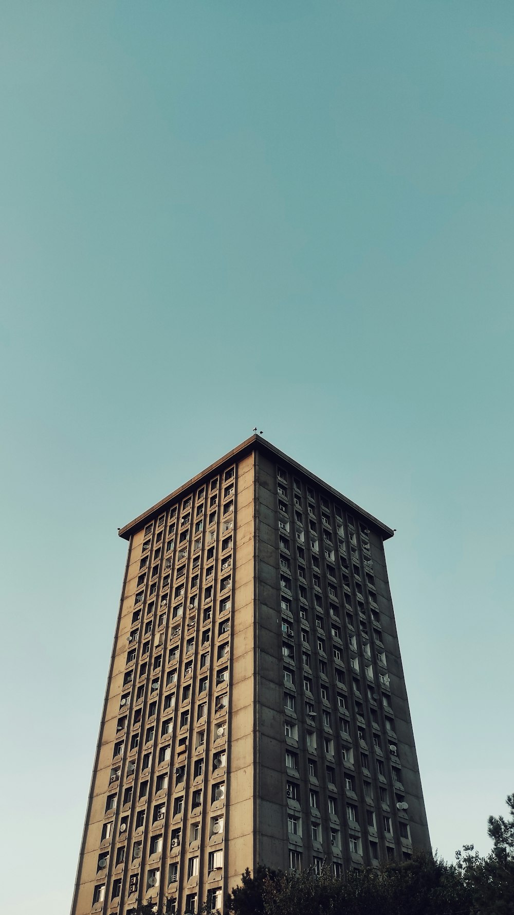 a tall building with lots of windows on top of it