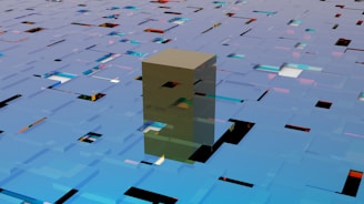 A geometric and abstract scene with a three-dimensional structure composed of interconnected rectangular shapes. The surface is reflective, with vibrant colors like blue, green, and orange reflecting off it.