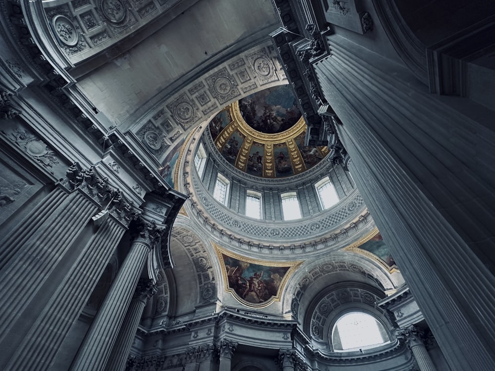 the ceiling of a large building with a dome