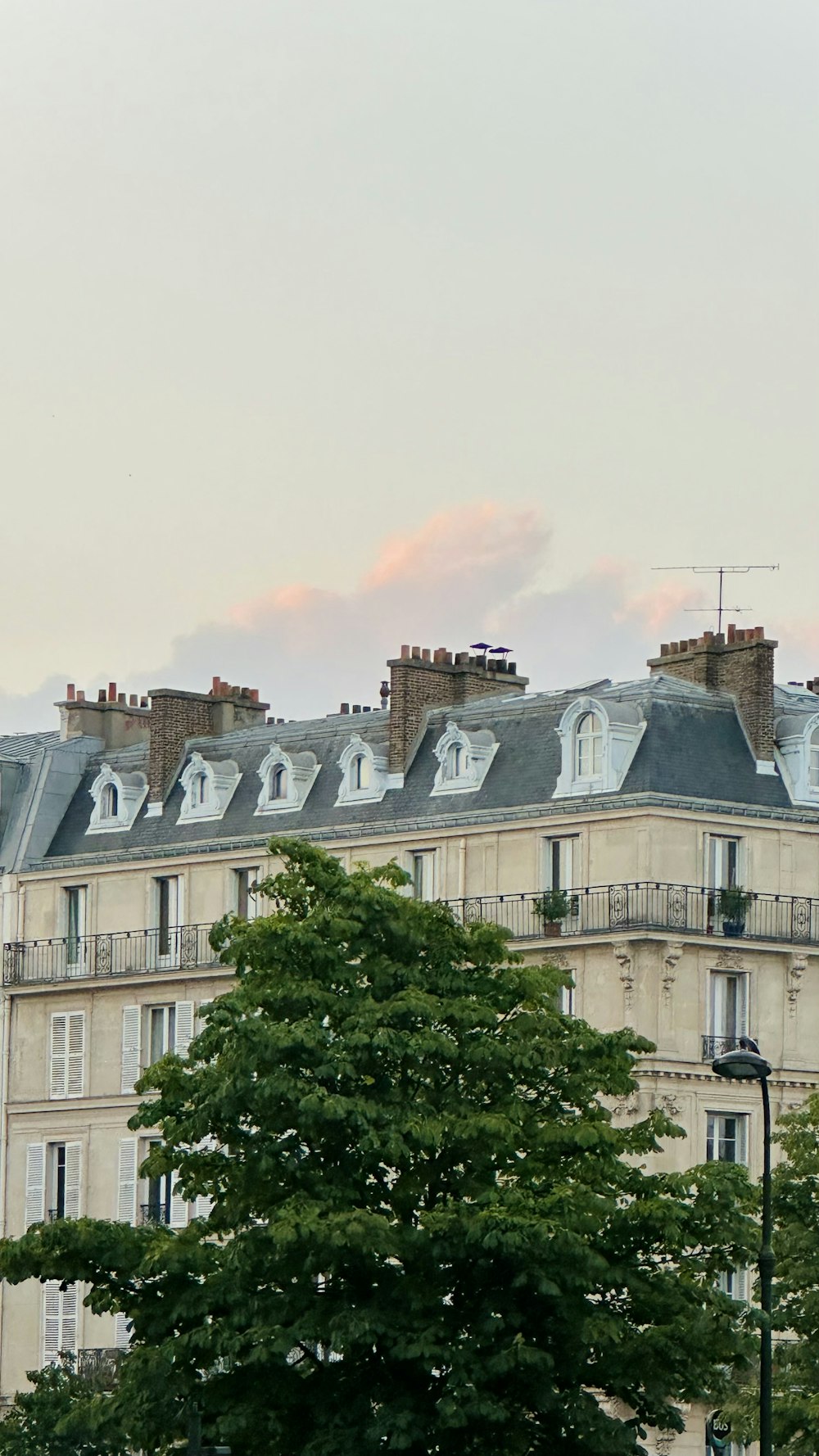 a tall building with a clock on the top of it