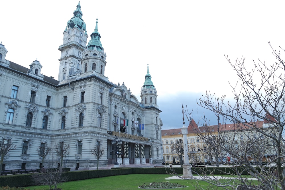 a large white building with a clock tower