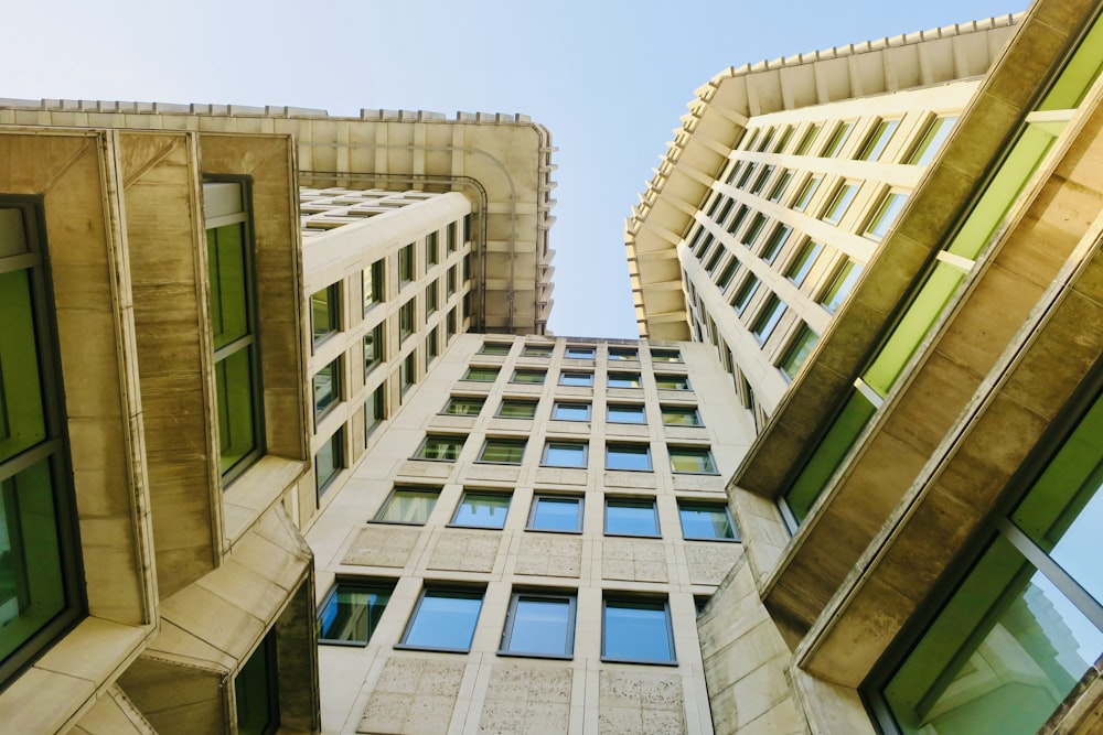 a tall building with lots of windows next to another building