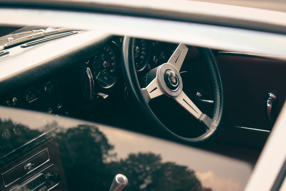 a close up of a steering wheel and dashboard of a car