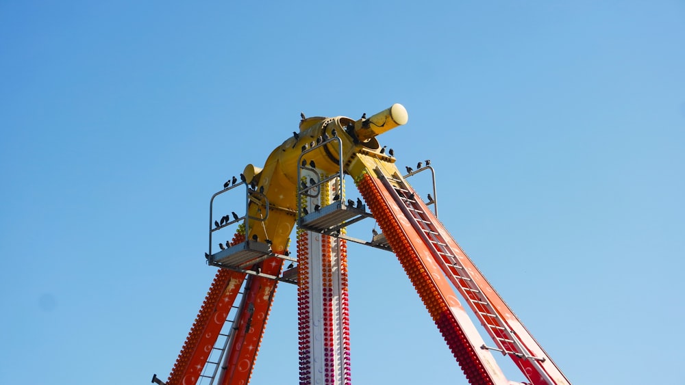 a roller coaster with a man on top of it