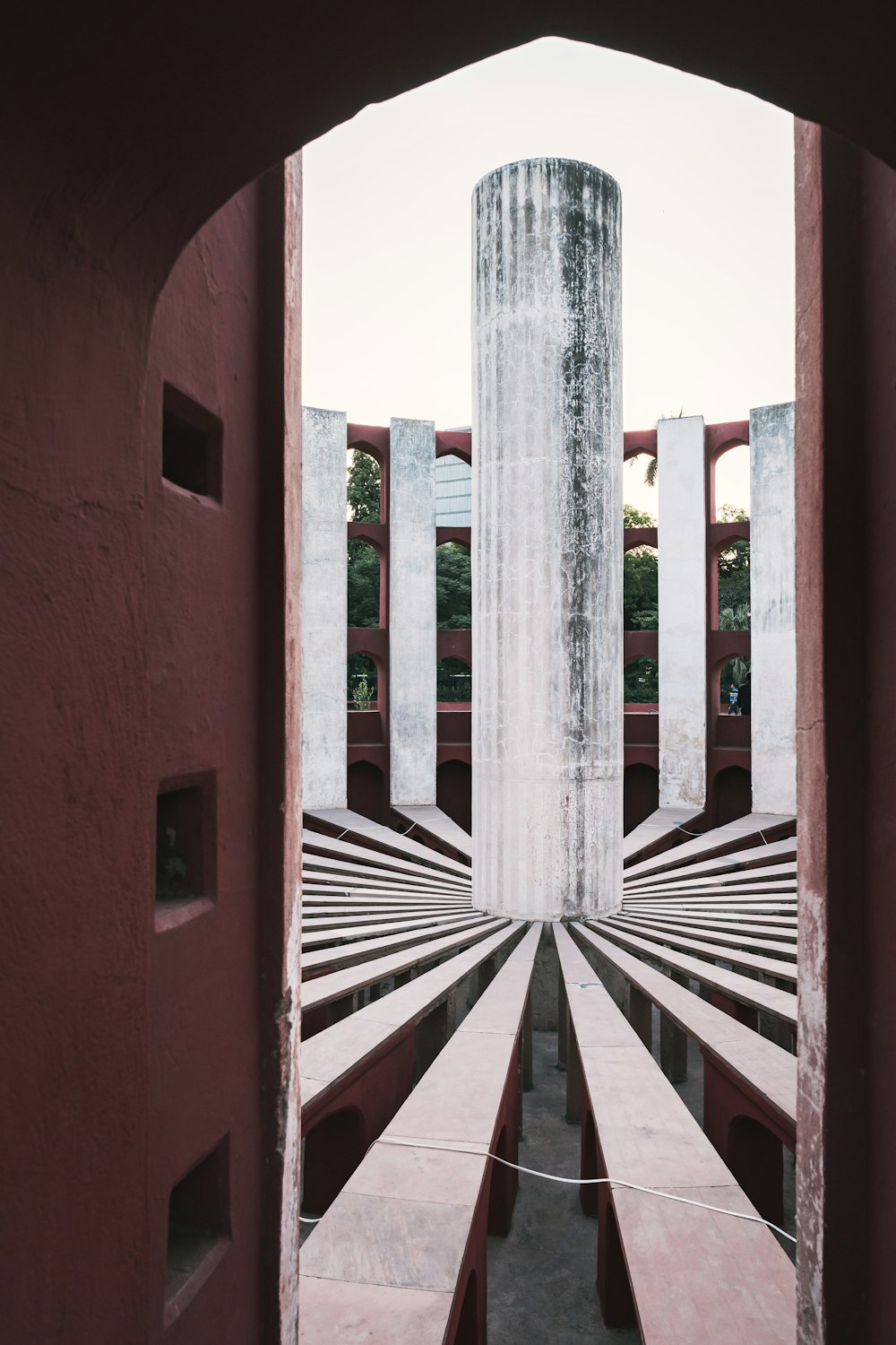 a view of a concrete structure through a doorway