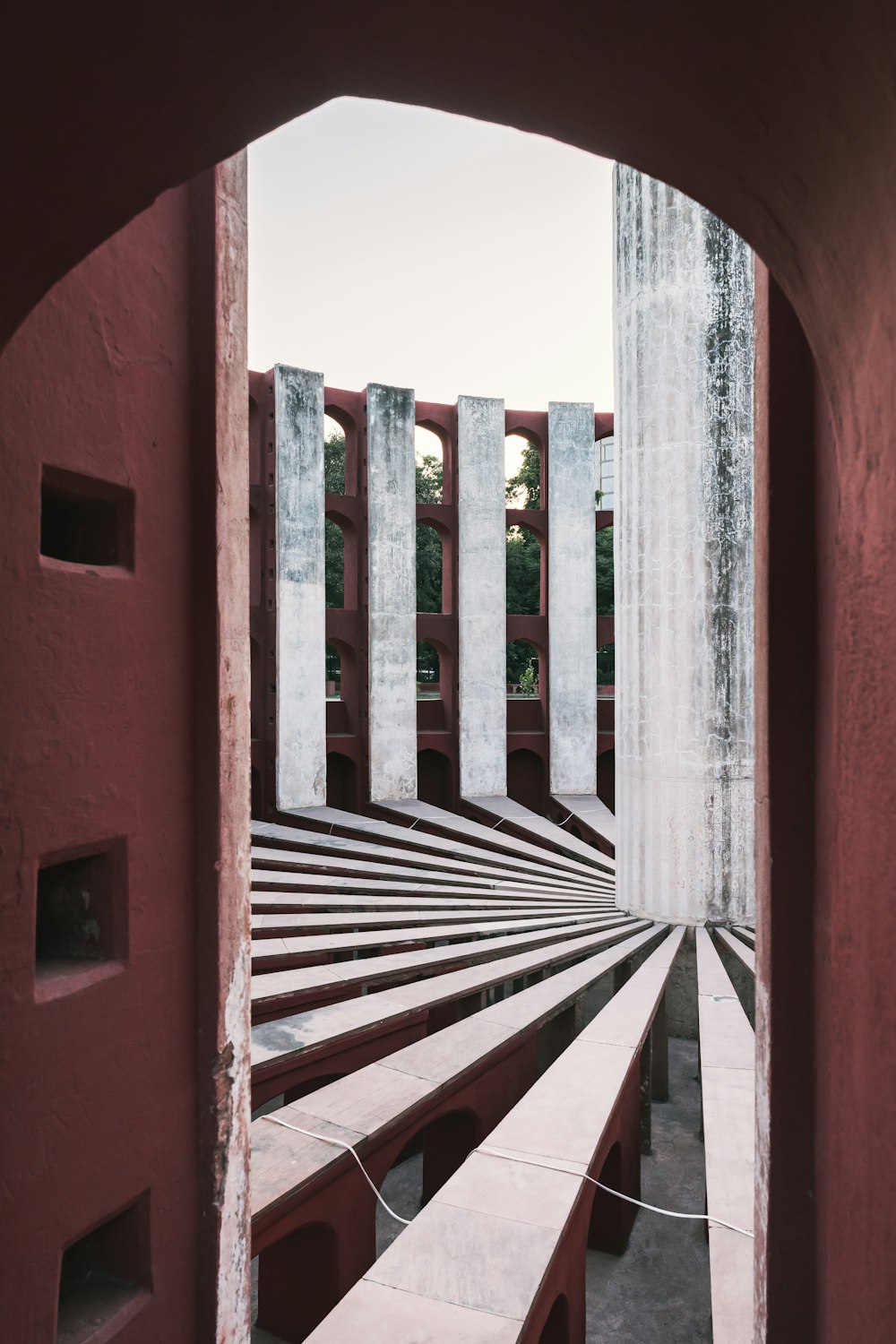 a view of a red building through a doorway