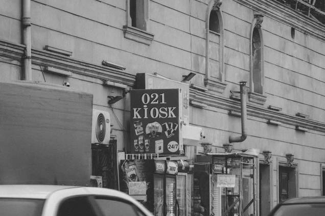 Historic black and white photo of the original Chekkuppa Traders storefront in Malappuram, capturing the early days of the business.