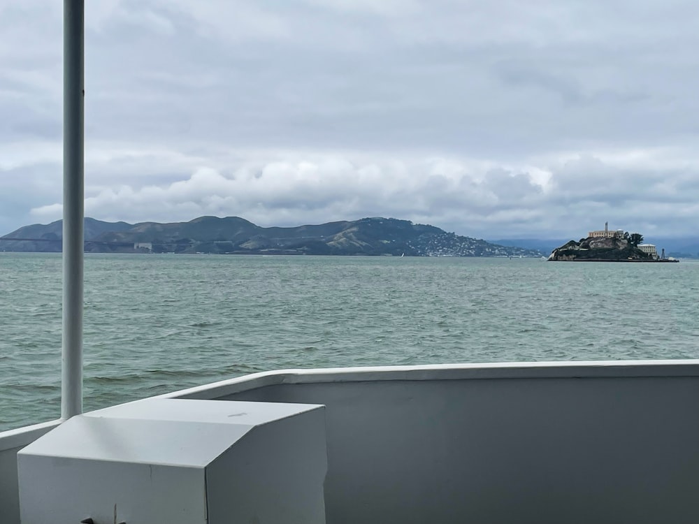 a large body of water with a small island in the distance