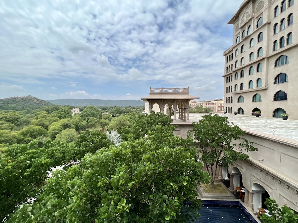 a view of a building with a pool in front of it