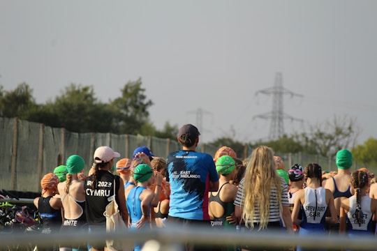 A photo of a fundraising event with families and swimmers.