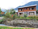 a house with a mountain in the background