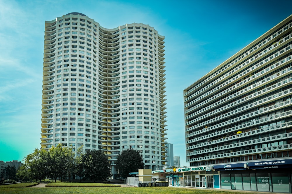 a couple of tall buildings sitting next to each other