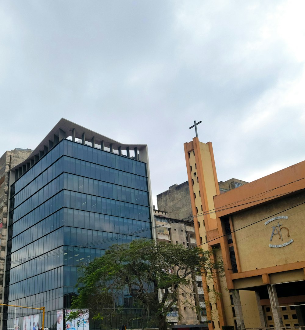 a tall building with a cross on top of it