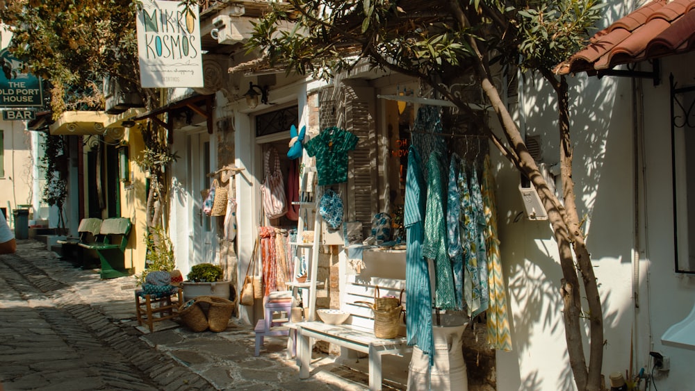 a store with a bunch of clothes hanging on the outside of it