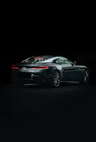 Side view of a sporty coupe with sleek curves and glossy finish