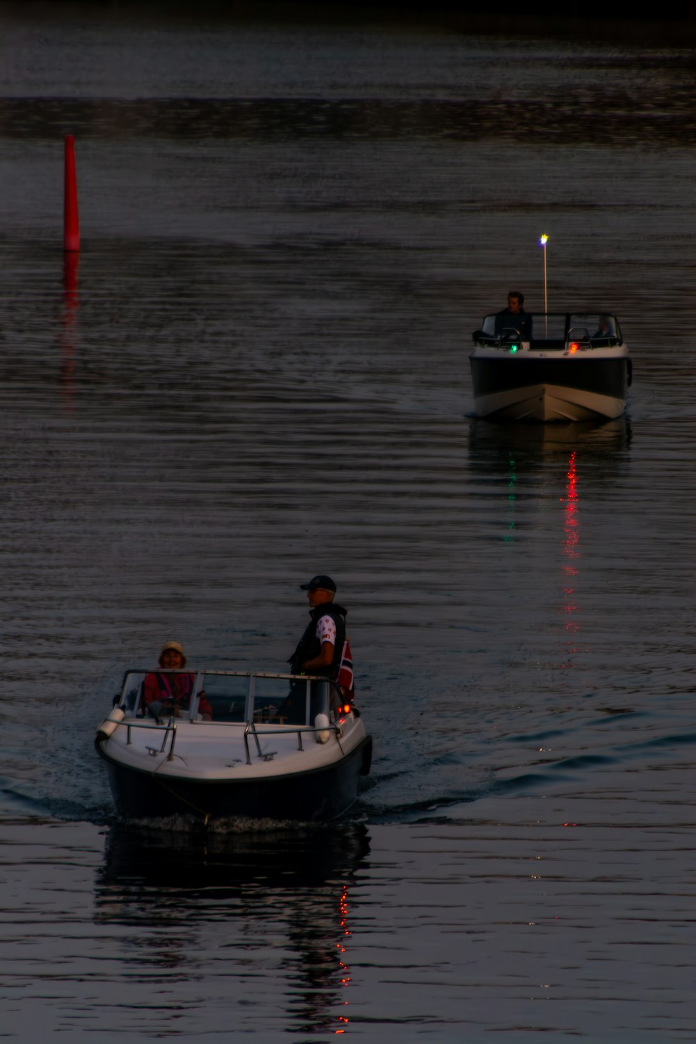 a couple of small boats on a body of water