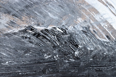 Minimalist black and white texture with subtle lines suggesting movement forward.