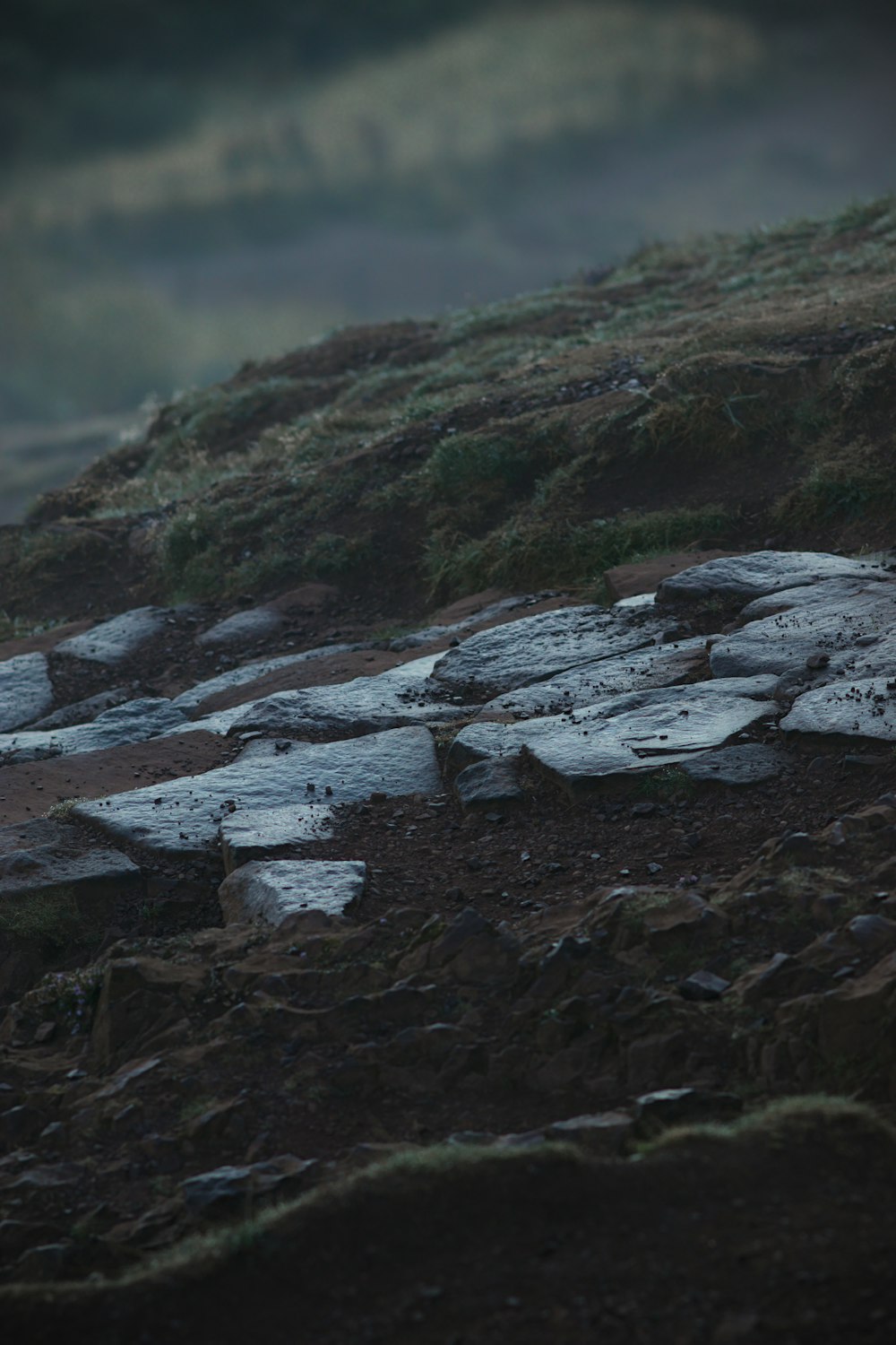 a group of rocks sitting on top of a hill