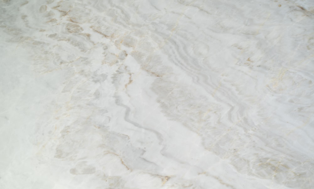 a close up of a white marble surface