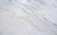 a close up of a white marble counter top