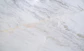 a close up of a white marble counter top