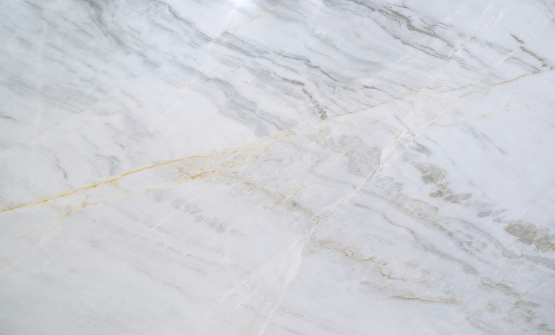 a close up of a white marble counter top