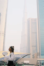 Portrait of a female city planner reviewing blueprints outdoors.