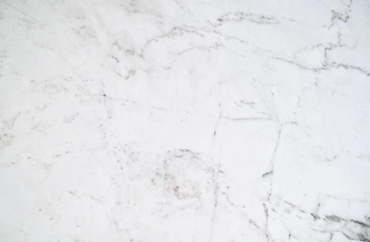 A serene marble background with subtle gold veins, softly illuminated to evoke calm and trust.