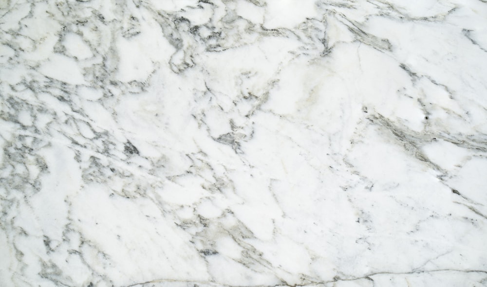 a close up of a white marble surface