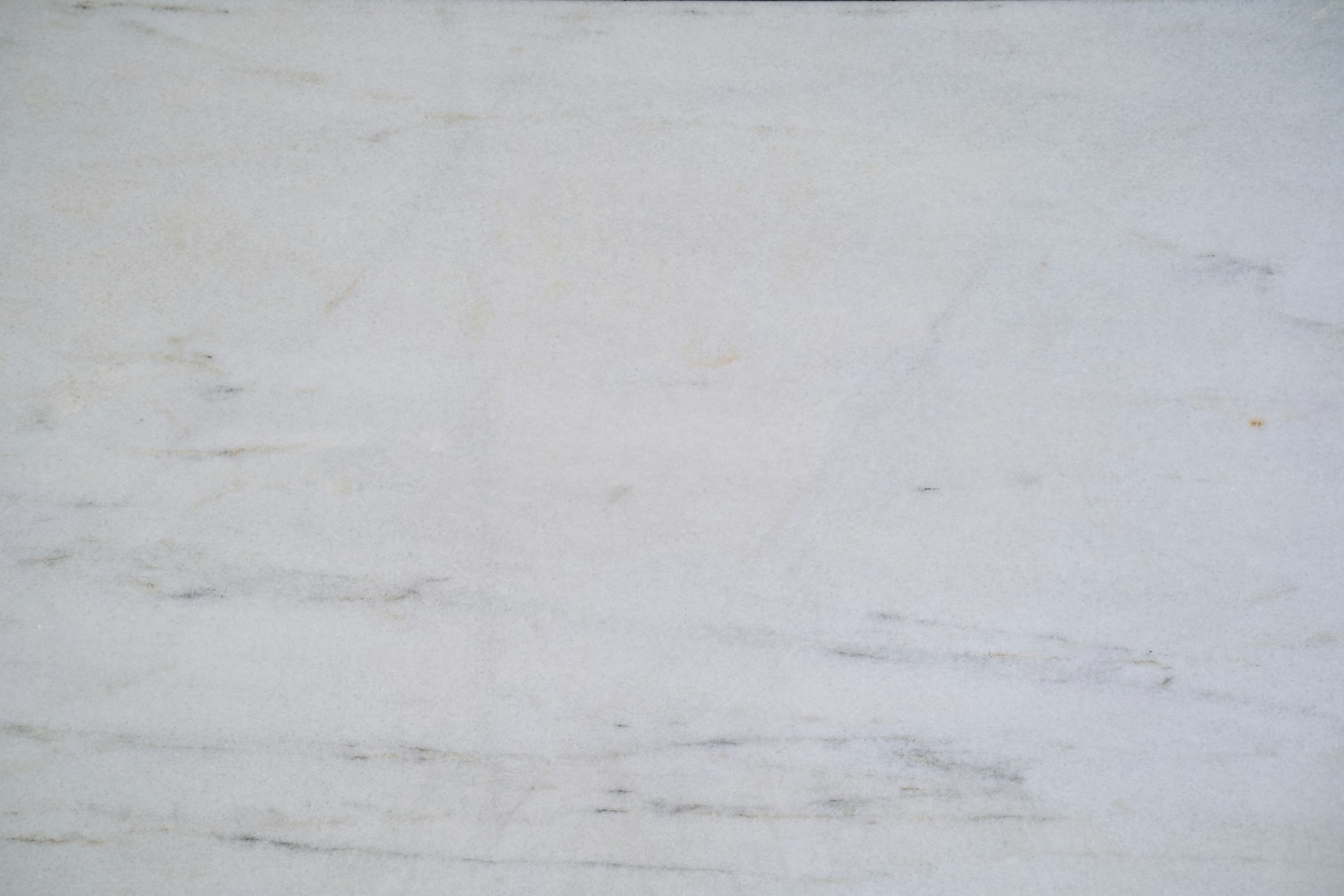 a close up of a white marble surface
