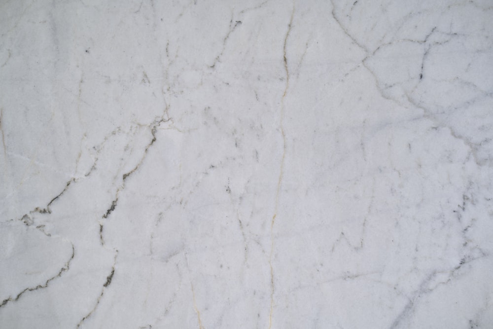 a close up of a white marble surface