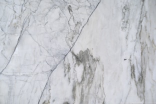 a close up of a white marble surface