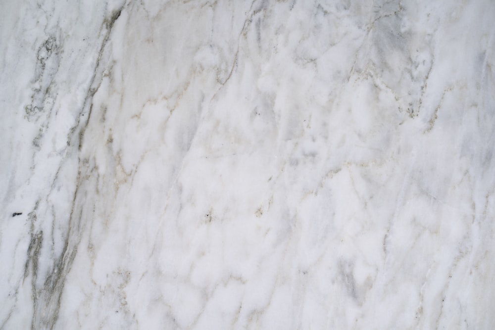 a close up of a white marble surface