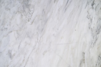 a close up of a white marble surface